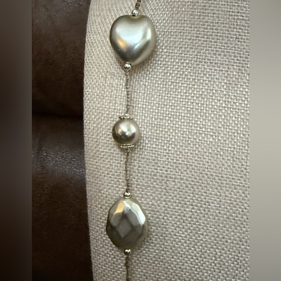 Featuring large silver faux pearls & silver shaped beads on thin wire or cord. - Picture 5 of 6